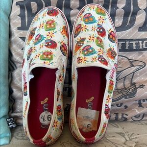 Vintage Skechers Floral Skull Slip-On Shoes
Size 9 1/2
Used